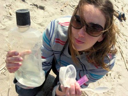 Sickatating plastic crap on the beach